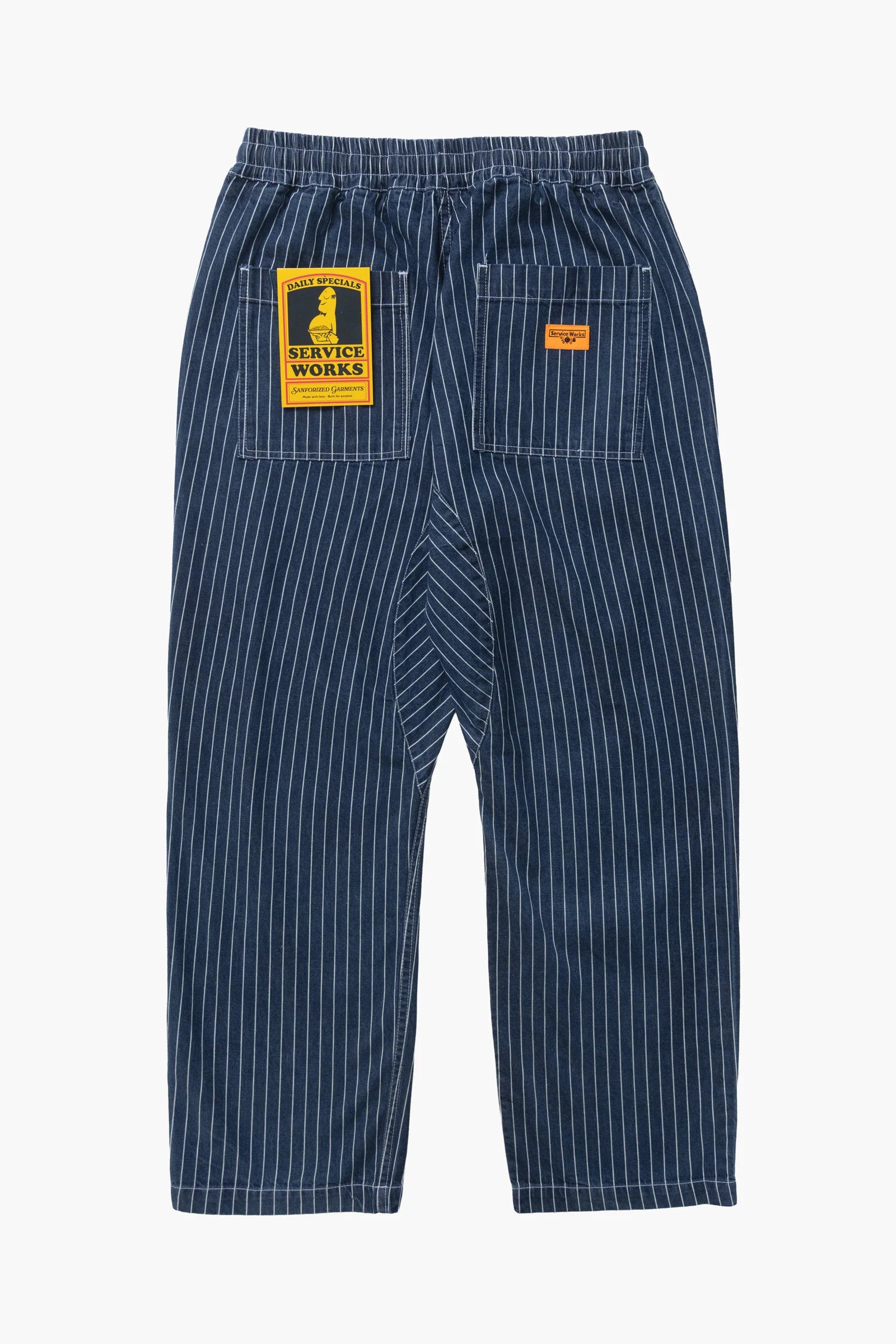 Blue pinstripe pants with two patches on a white background