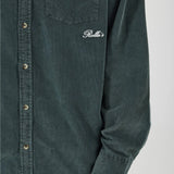 Green shirt with a brand logo on a white background