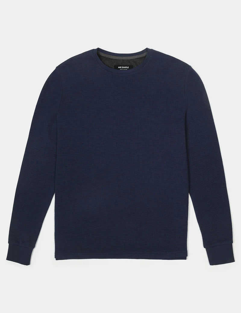 Navy blue sweater on a light gray background