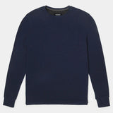 Navy blue sweater on a light gray background