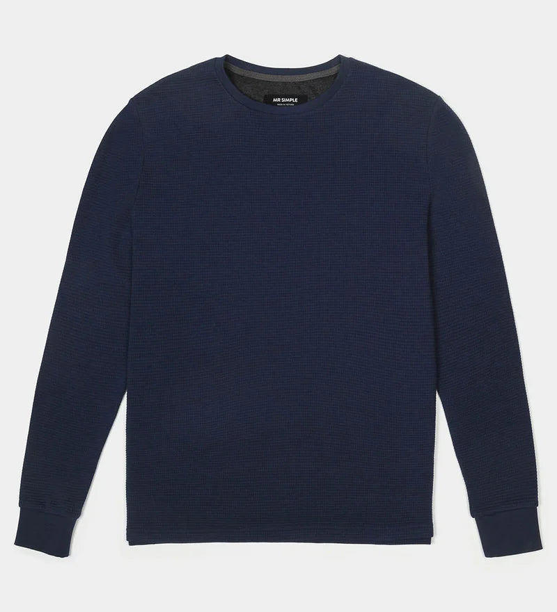 Navy blue sweater on a light gray background