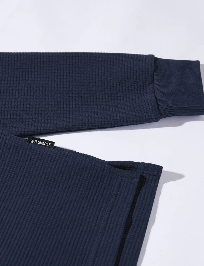 Navy ribbed sweater on a light gray background with 'MR SIMPLE' label.