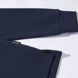 Navy ribbed sweater on a light gray background with 'MR SIMPLE' label.