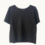 A black summer tee from Little Lies, displaying a short-sleeved, round neckline, and a casual fit.