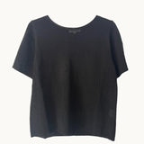 A black summer tee from Little Lies, displaying a short-sleeved, round neckline, and a casual fit.