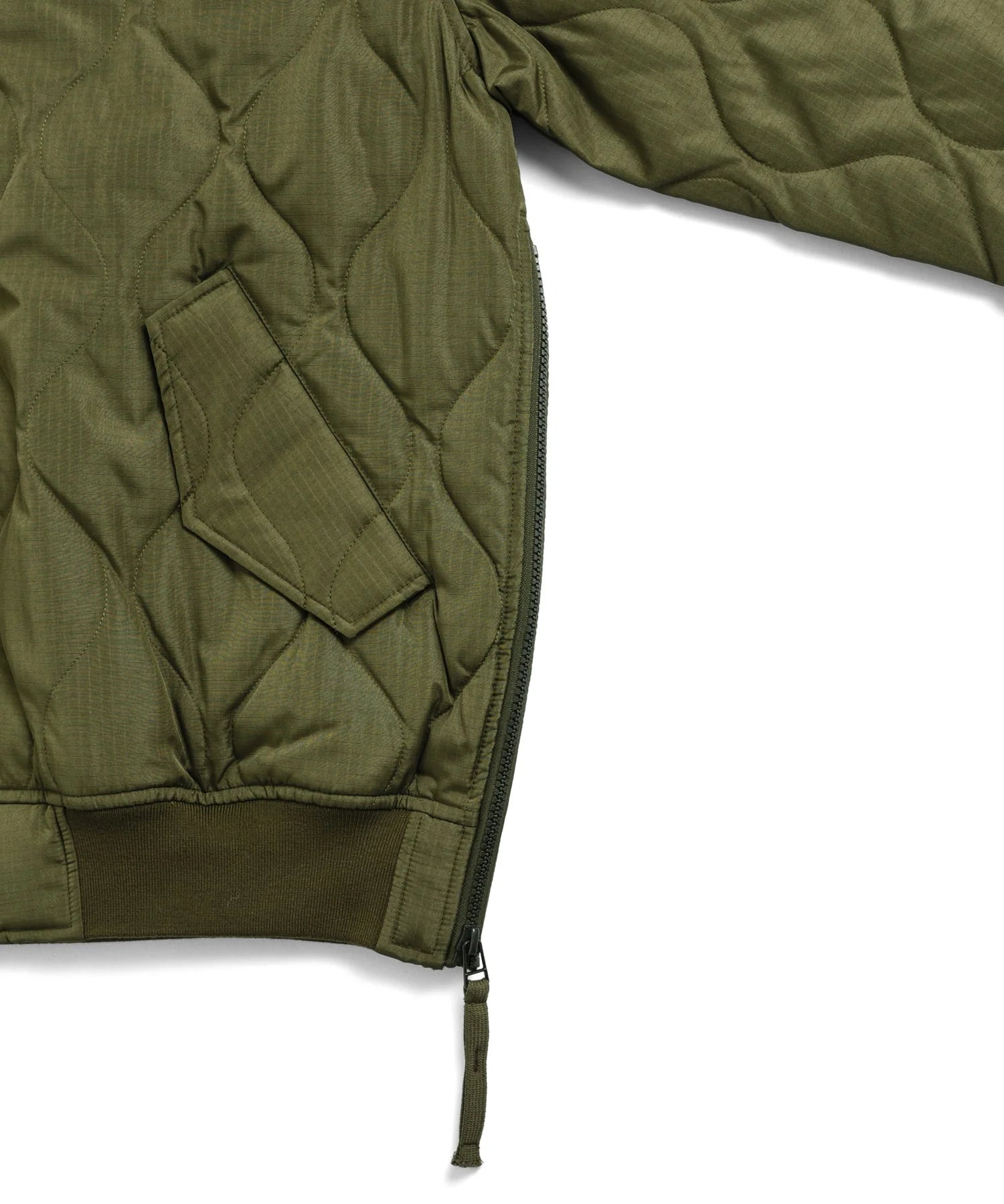 Green quilted jacket on a white background