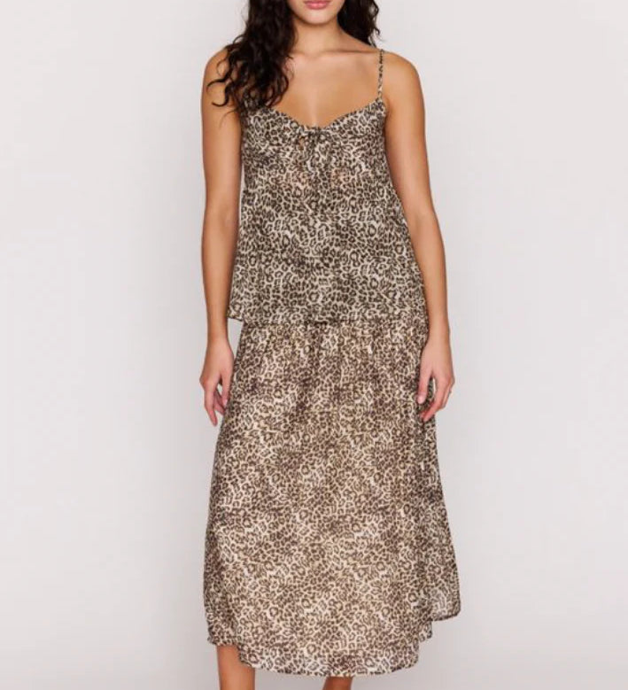 Woman wearing a patterned dress on a white background