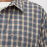Close-up of a plaid shirt with a collar on a white background