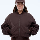 Person wearing a brown jacket and cap with 'EP' logo on a white background