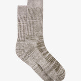 Green textured sock on a white background