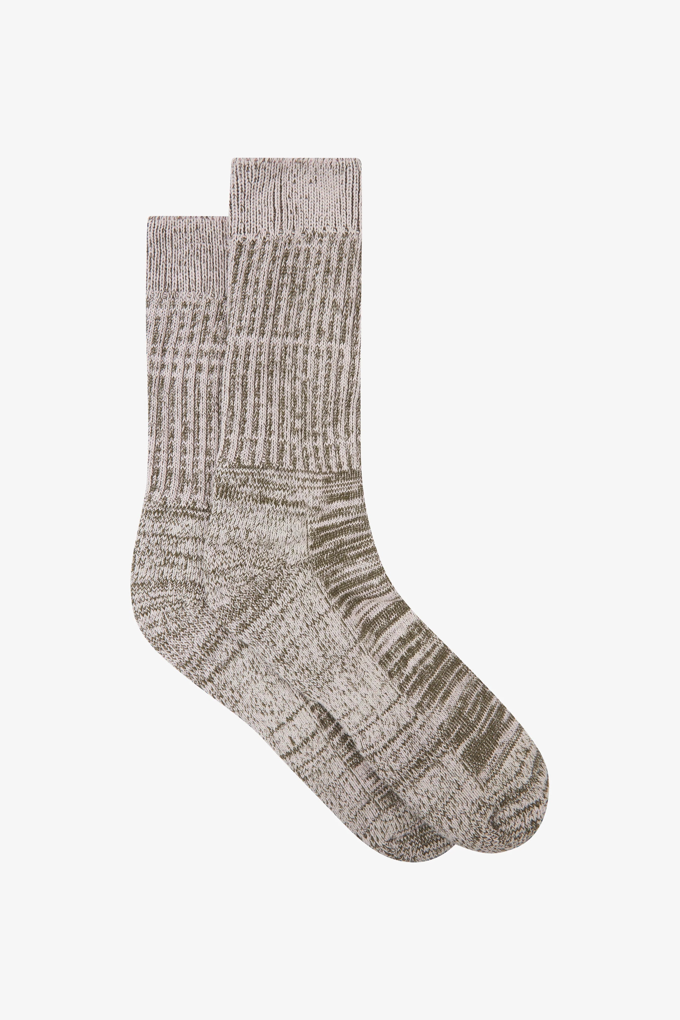 Green textured sock on a white background