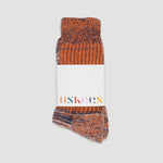 Pair of brown patterned socks with a visible brand label on a white background