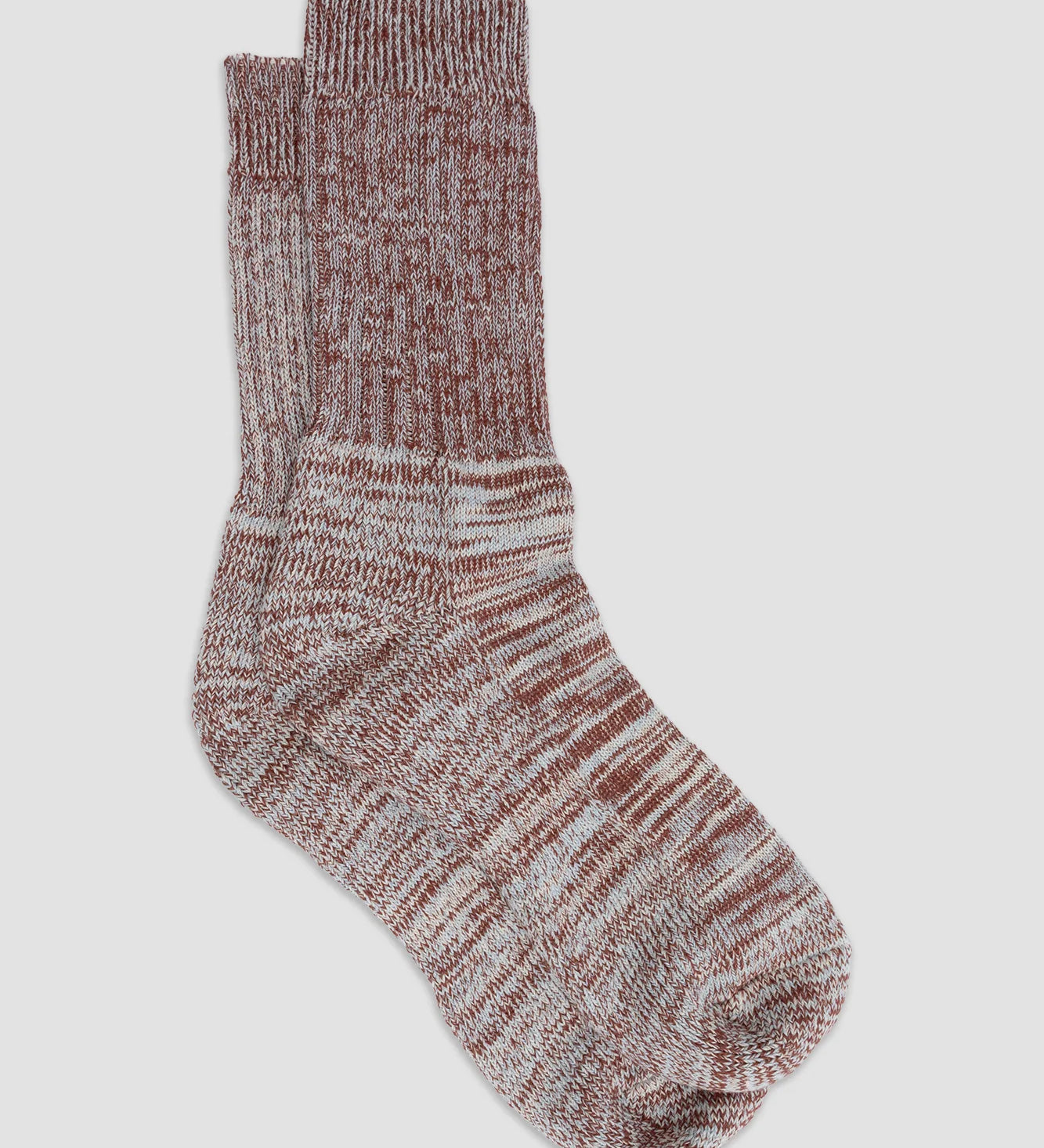 Pair of marled brown socks on a light gray background