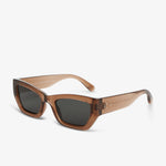 Sunglasses with brown frame and dark lenses on a white background