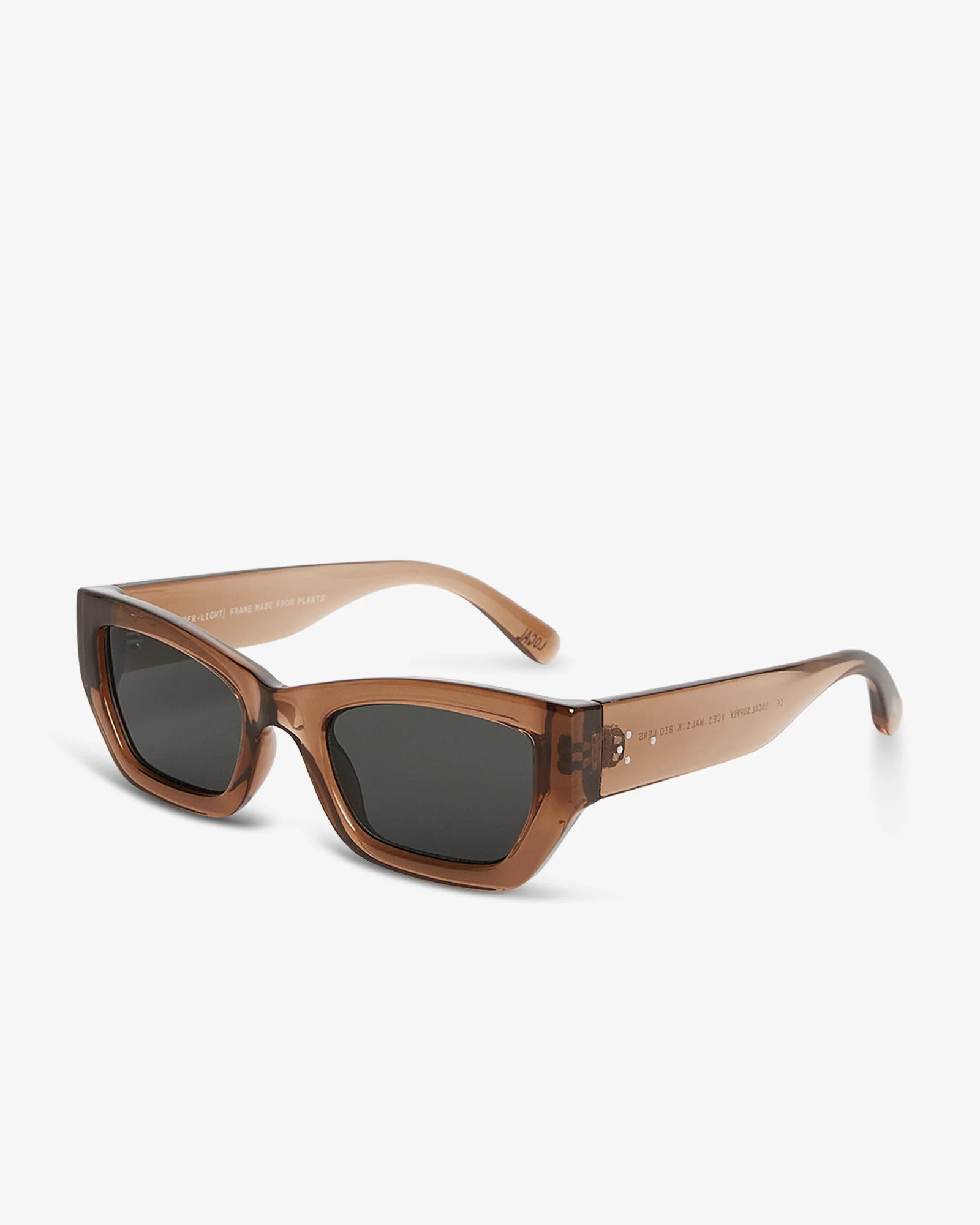Sunglasses with brown frame and dark lenses on a white background