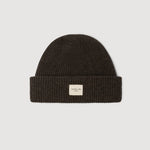 Ganache knit beanie with a small label on a light gray background
