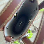 Inside of a brown craie studio ame leather bag