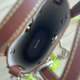 Inside of a brown craie studio ame leather bag