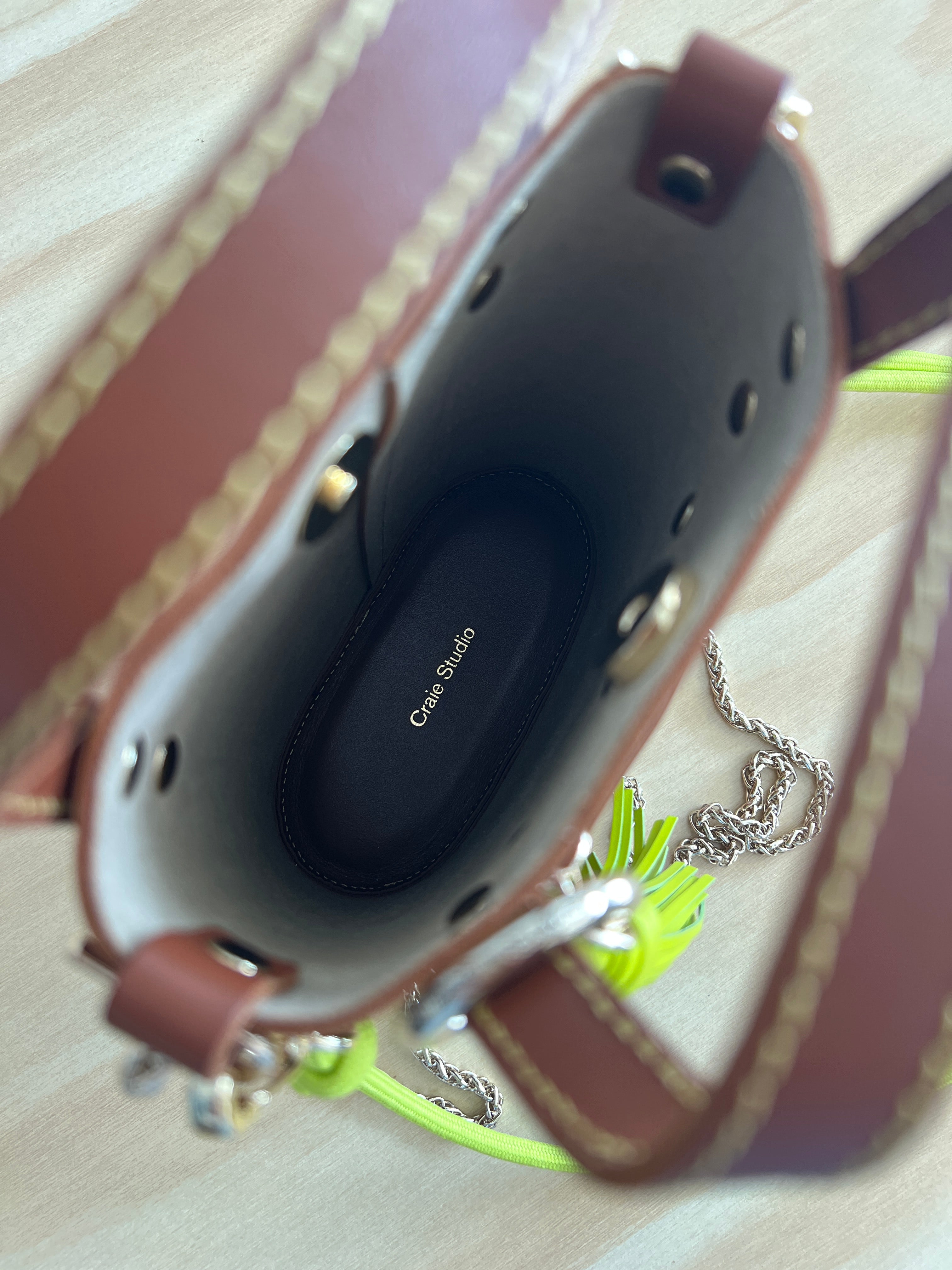 Inside of a brown craie studio ame leather bag