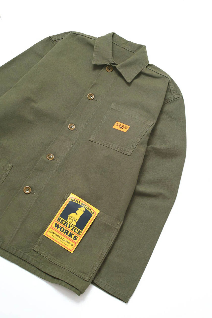 Green shirt with patches on a white background