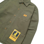 Green shirt with patches on a white background