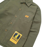 Green shirt with patches on a white background