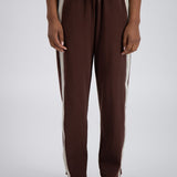 close up detail of brown trackpants.