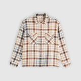A long-sleeve plaid button-up shirt in beige, brown, and blue tones, laid flat against a light gray background.