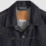 Close-up of a Levi's denim jacket collar with brand label.