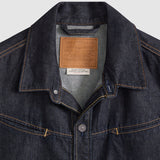 Close-up of a Levi's denim jacket collar with brand label.