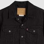 Black Levi's jacket with brand logo on a light gray background