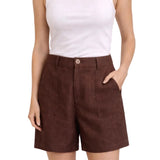 Brown shorts worn by a person on a white background