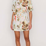 Woman wearing a floral dress on a white background
