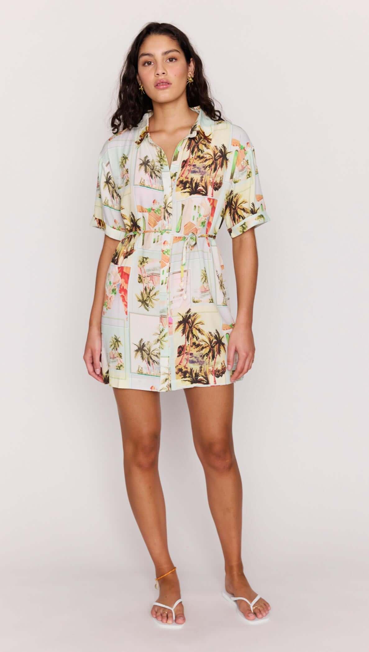 Woman wearing a floral dress on a white background