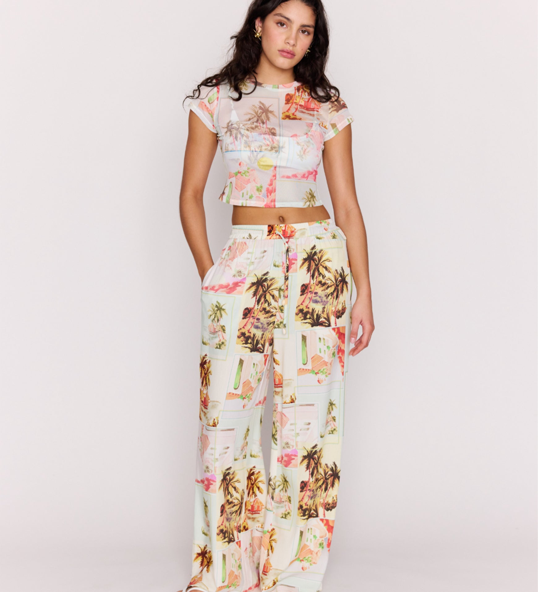 Woman wearing a floral outfit on a white background