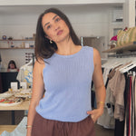 Women Modelling Blue tank top and brown pants