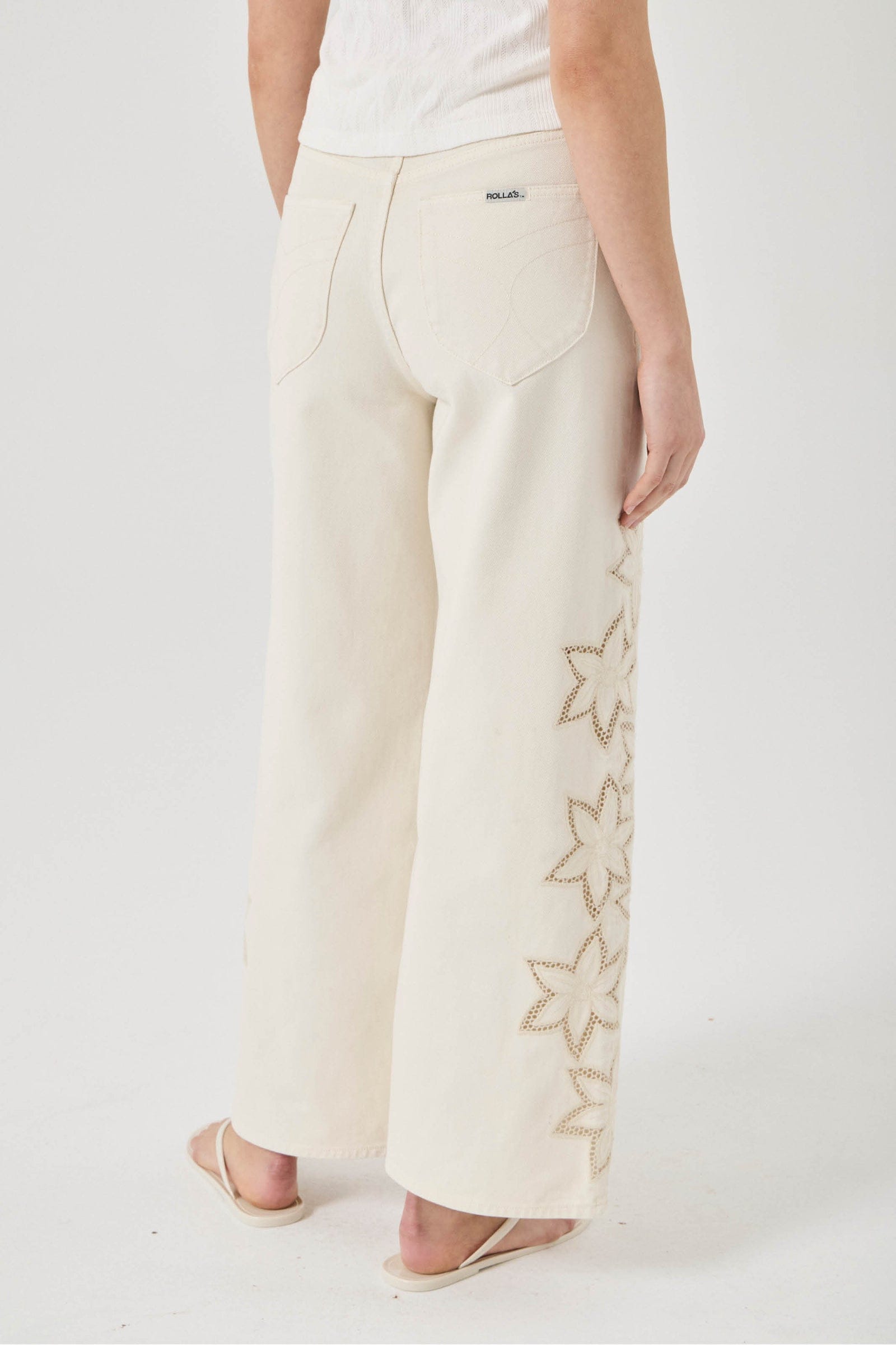 White pants with star patterns on a white background