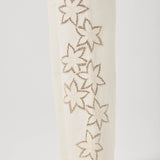 White pants with star-shaped cutouts on a white background