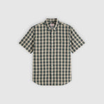 Green and beige checkered shirt on a light gray background
