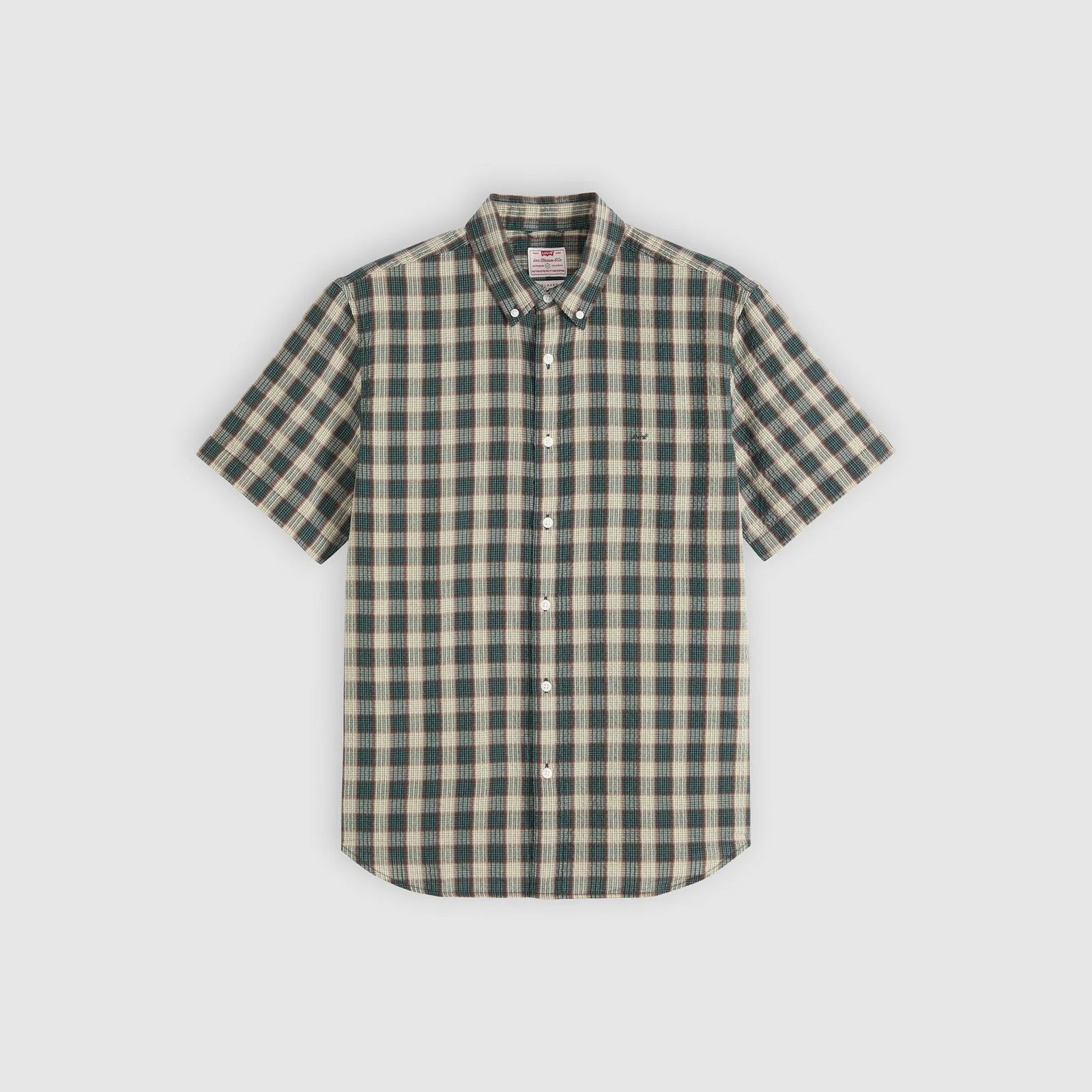 Green and beige checkered shirt on a light gray background