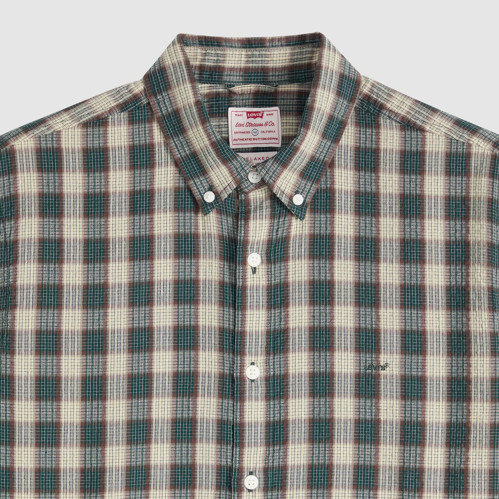 Plaid shirt with Levi's label on a light gray background