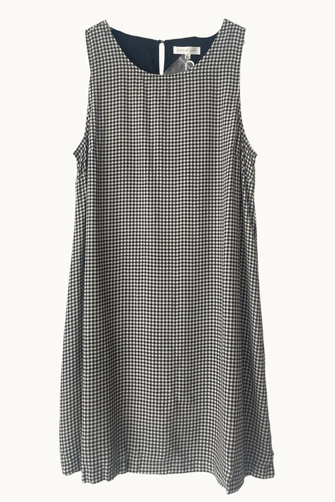 Black and white gingham dress on a white background